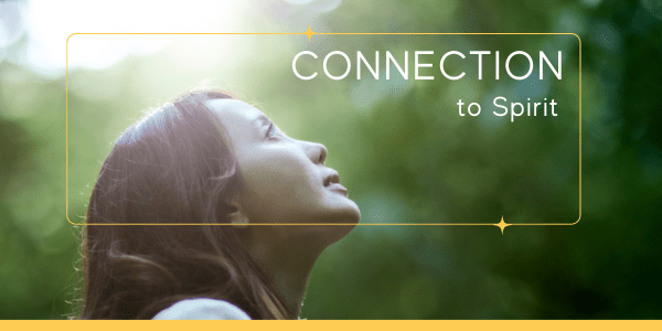 Young woman looking up to the sky with a hopeful yet concerned expression, practicing connection to spirit techniques for emotional regulation.