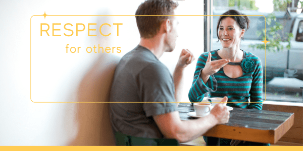 Two people having a respectful, open conversation over coffee—practicing authentic living exercises and unconditional positive regard.