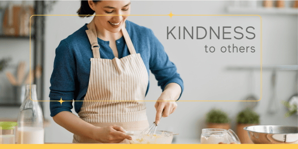 A woman practicing authentic living by showing kindness, sharing her value-driven passion for baking with someone in need.