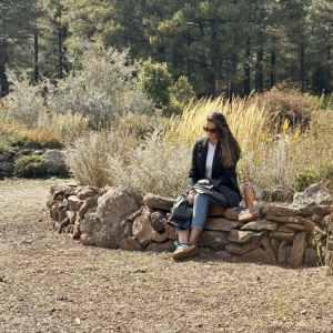 Participant mindfully sitting at a Flagstaff forest corporate team building event